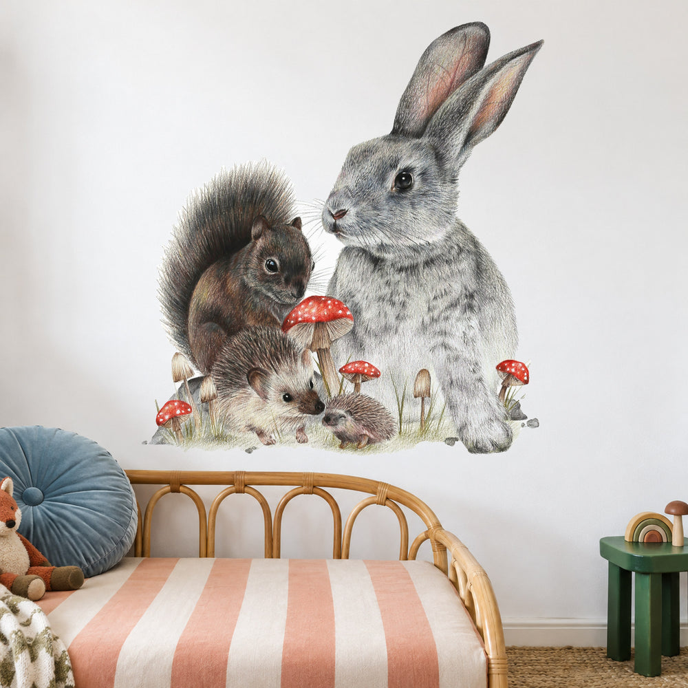 Bunny & Friends by Olivia Bezett, wall decal room mock-up in a child’s bedroom above a rattan headboard.