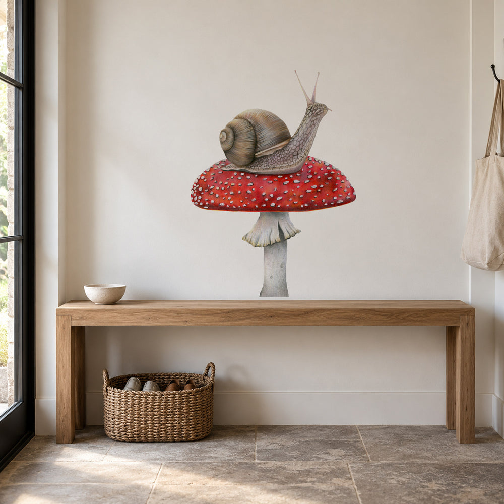 Snail on Mushroom by Olivia Bezett, wall decal room mock-up in a room above a timber desk.