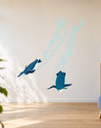Diving penguins wall decal in a modern library