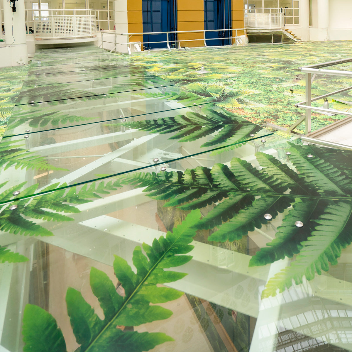 Layered transparent fern graphics on glazed walkways at Starship Children’s Hospital