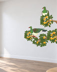 Karaka Branch with Kererū wall decal room visualisation – smaller artwork in a neutral room