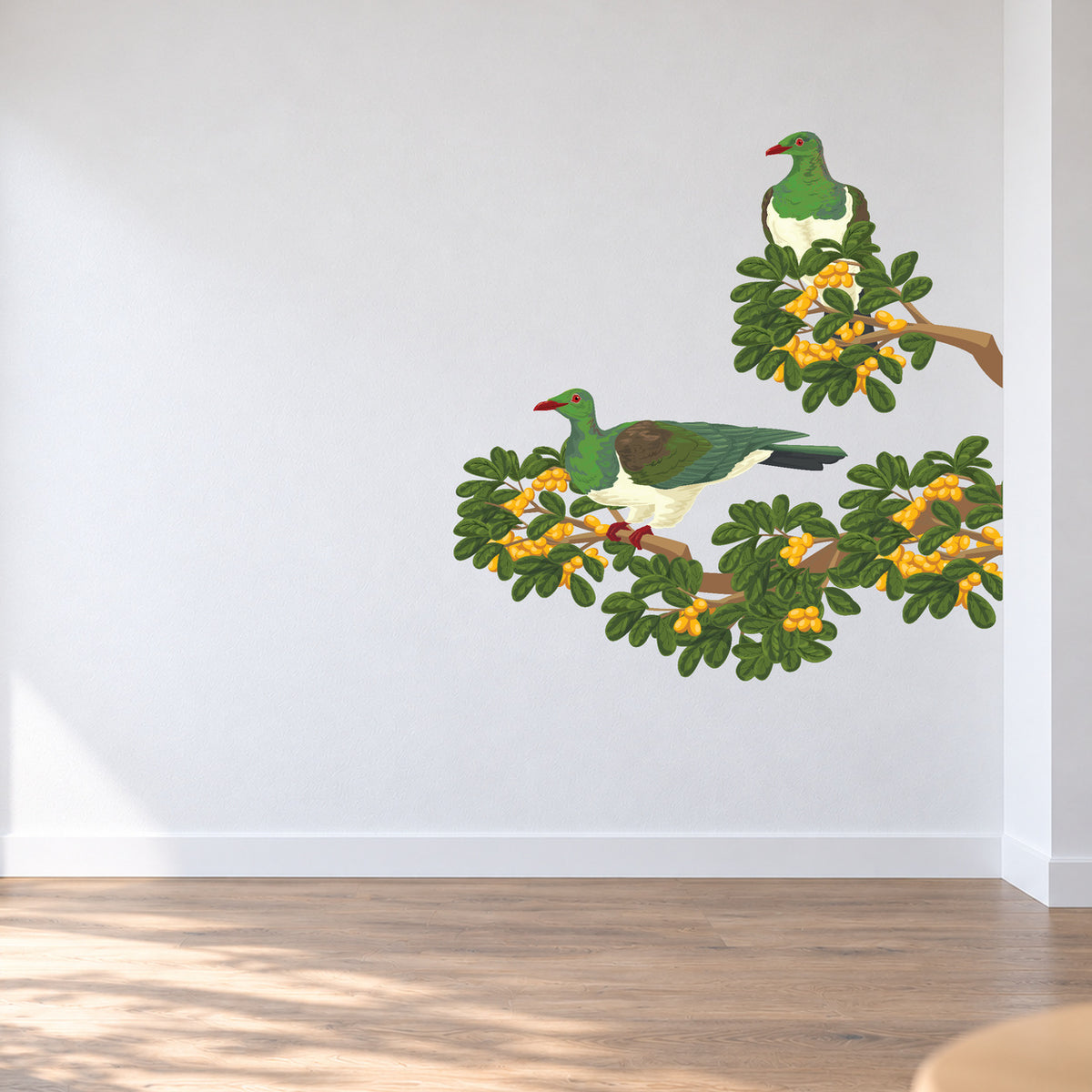 Karaka Branch with Kererū wall decal room visualisation – smaller artwork in a neutral room