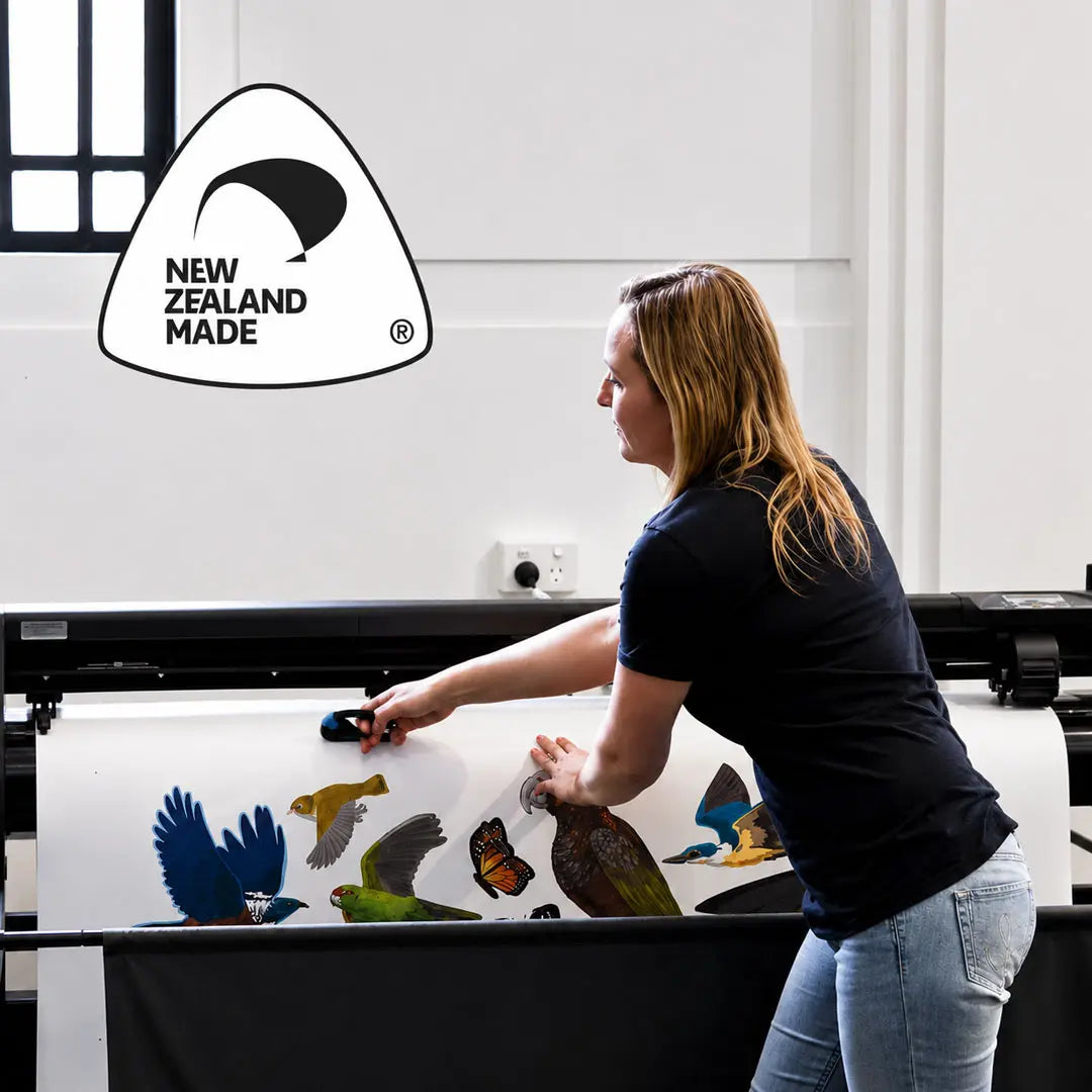 Large sheets of wall artwork being handled at the studio printer
