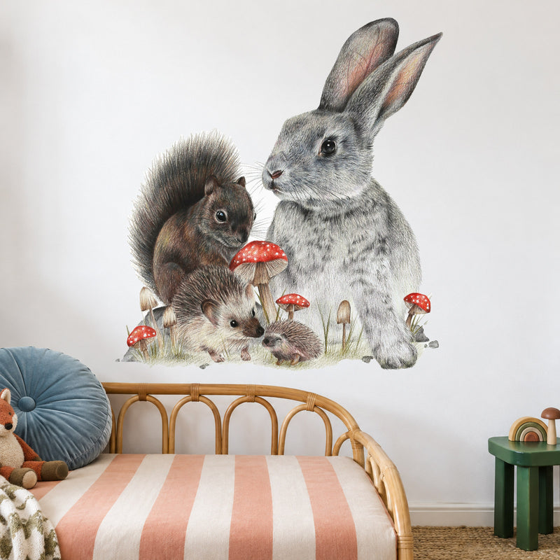 Bunny & Friends by Olivia Bezett, wall decal room mock-up in a child’s bedroom above a rattan headboard.