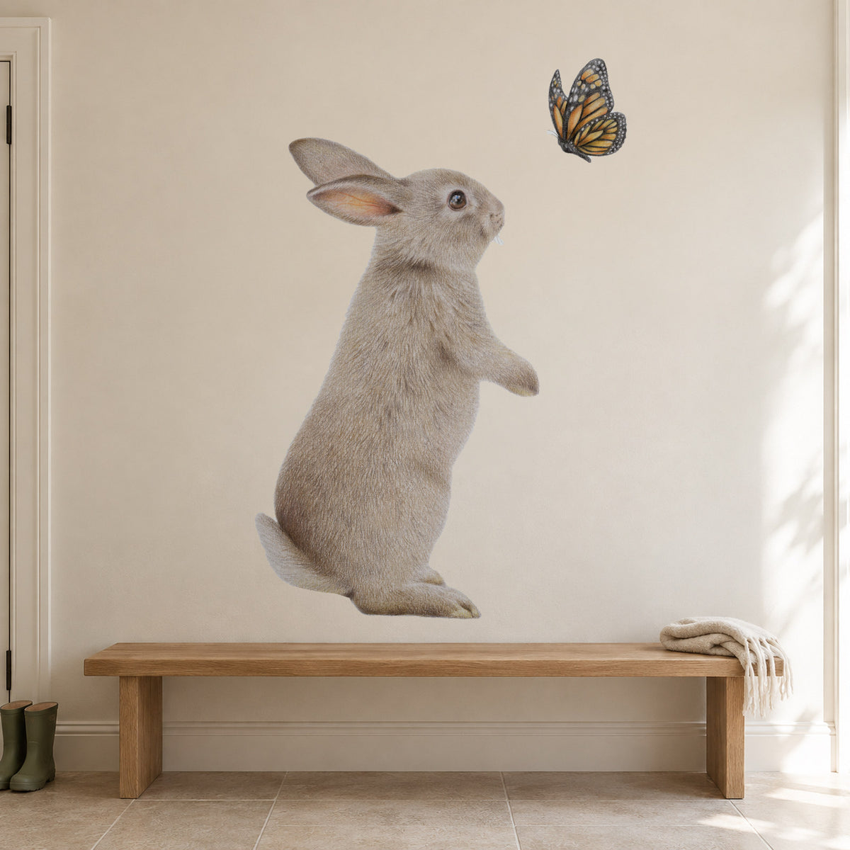 Bunny and Butterfly by Olivia Bezett, wall decal room mock-up in a room above a low timber bench.