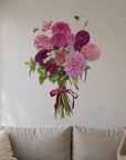 Dahlia Bouquet by Olivia Bezett, wall decal room mock-up in a living room above a grey sofa.