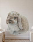 Daisy Bunny by Olivia Bezett, wall decal room mock-up in a nursery above a low cabinet.