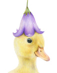 Duckling by Olivia Bezett, original artwork detail showing the duckling’s face and purple flower hat.