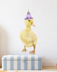 Duckling by Olivia Bezett, wall decal room mock-up in a child’s room above a striped bench.