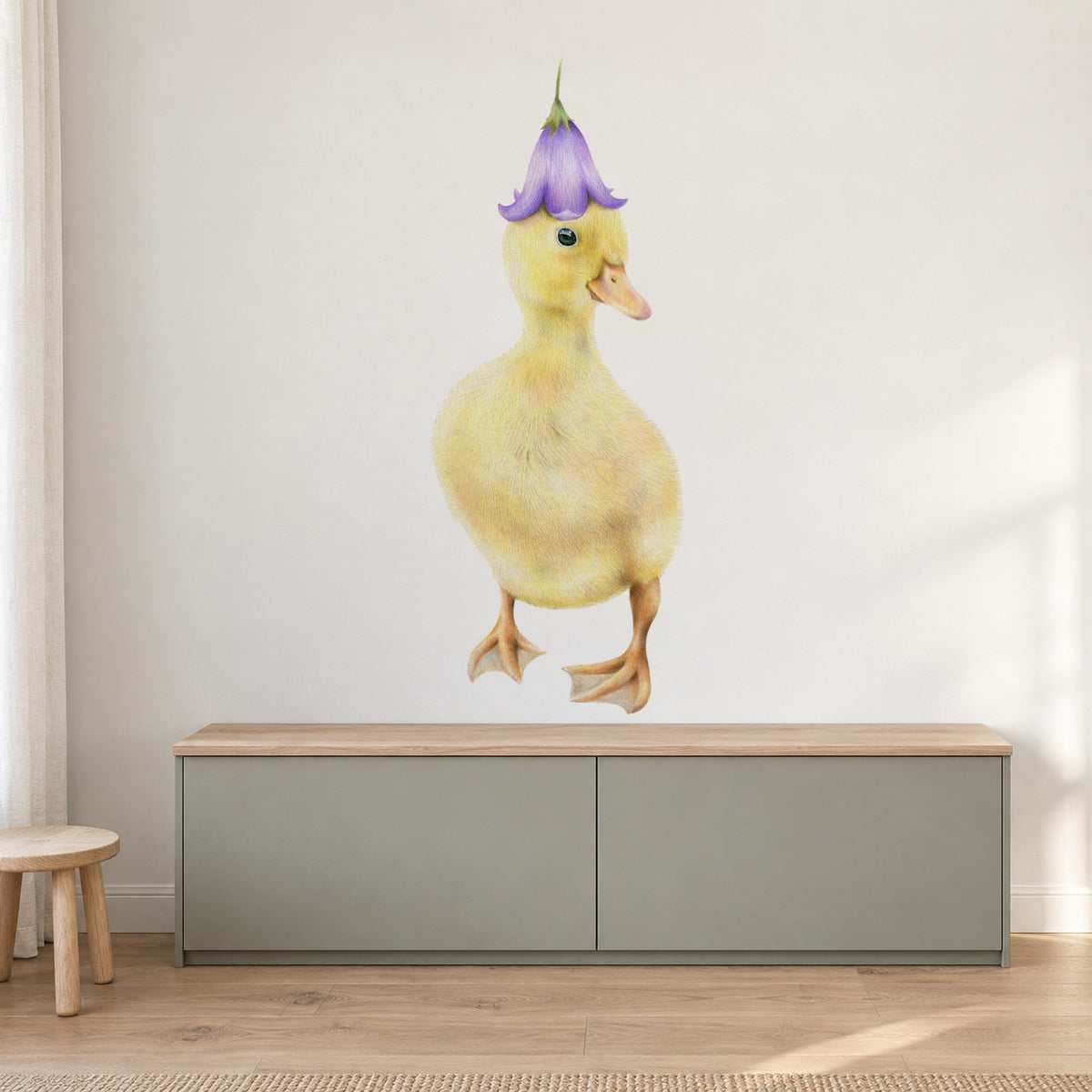 Duckling by Olivia Bezett, wall decal room mock-up in a living room above a low cabinet.