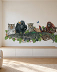 Jungle Friends by Olivia Bezett, wall mural room mock-up in a living room above a low timber bench.