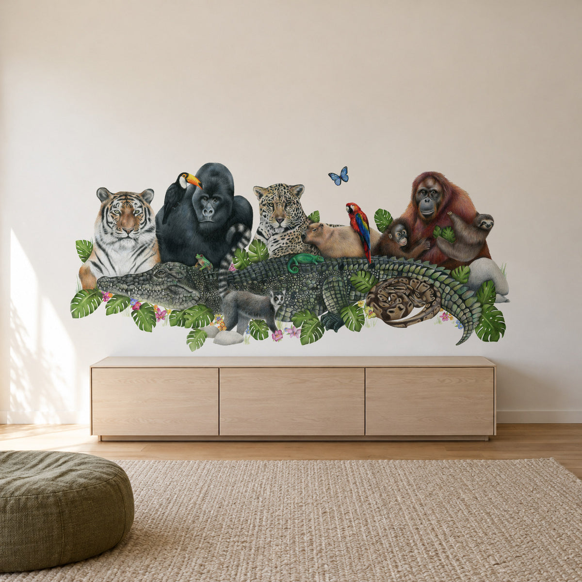 Jungle Friends by Olivia Bezett, wall mural room mock-up in a living room above a low timber cabinet.