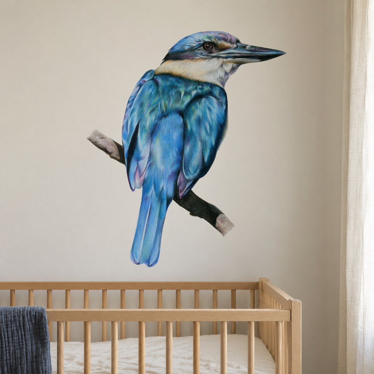 Kōtare by Olivia Bezett, wall decal room mock-up in a nursery above a timber cot.