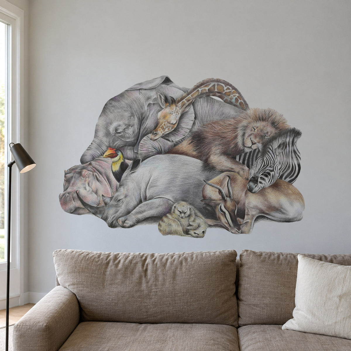 Safari Sleepers by Olivia Bezett, wall decal room mock-up in a living room above a grey sofa.