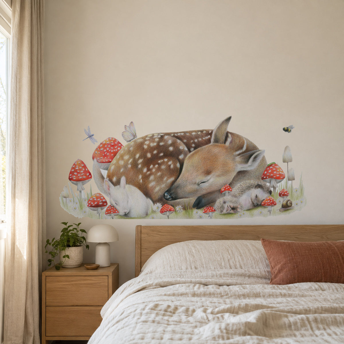Sleeping Doe by Olivia Bezett, wall decal room mock-up in a bedroom above a timber headboard.