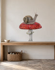 Snail on Mushroom by Olivia Bezett, wall decal room mock-up in a room above a timber desk.