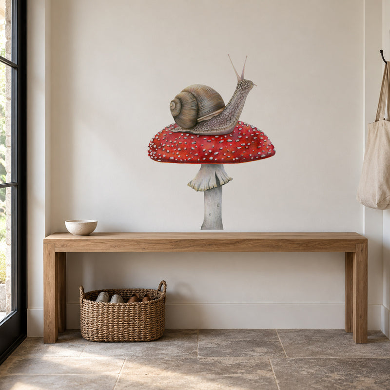 Snail on Mushroom by Olivia Bezett, wall decal room mock-up in a room above a timber desk.
