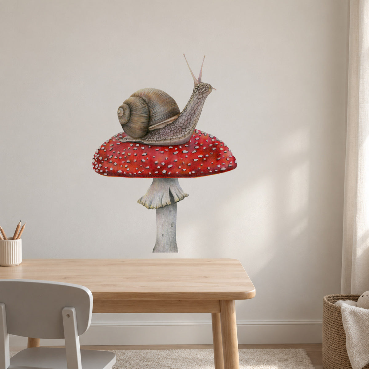 Snail on Mushroom by Olivia Bezett, wall decal room mock-up in a study above a pale timber table.