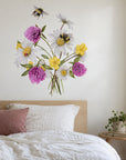 Wildflower Bees by Olivia Bezett, wall decal room mock-up in a bedroom above a pale pink headboard.