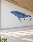 Humpback whale pair in a large hallway room view from the head-side angle