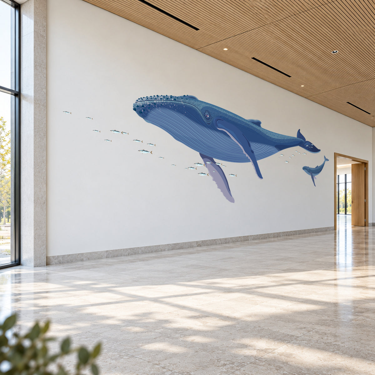 Humpback whale pair in a large hallway room view from the head-side angle
