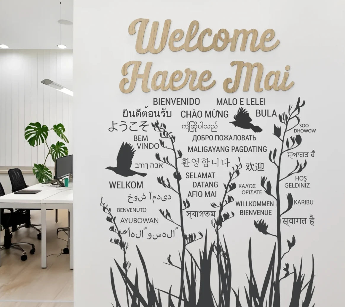 Welcome Hāere Mai wooden wall art installed on a wall